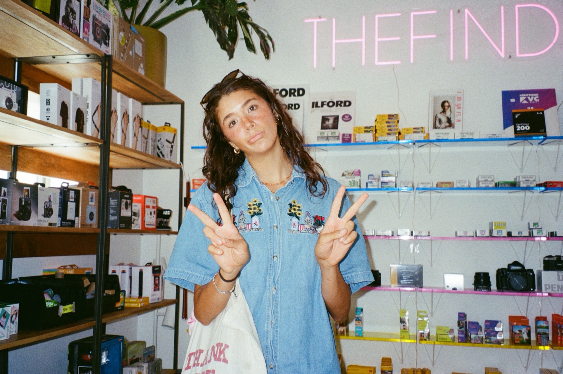 Kate Quayle, photographer, at a film photography shop
