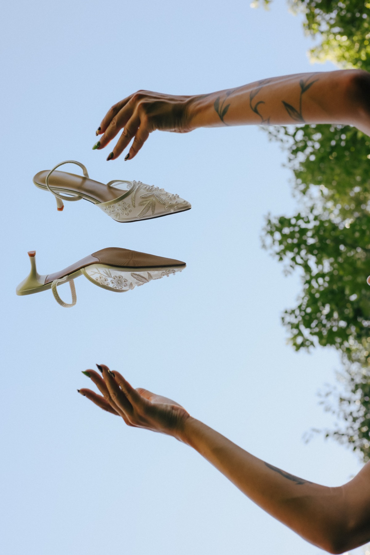 Wedding shoes thrown in the air