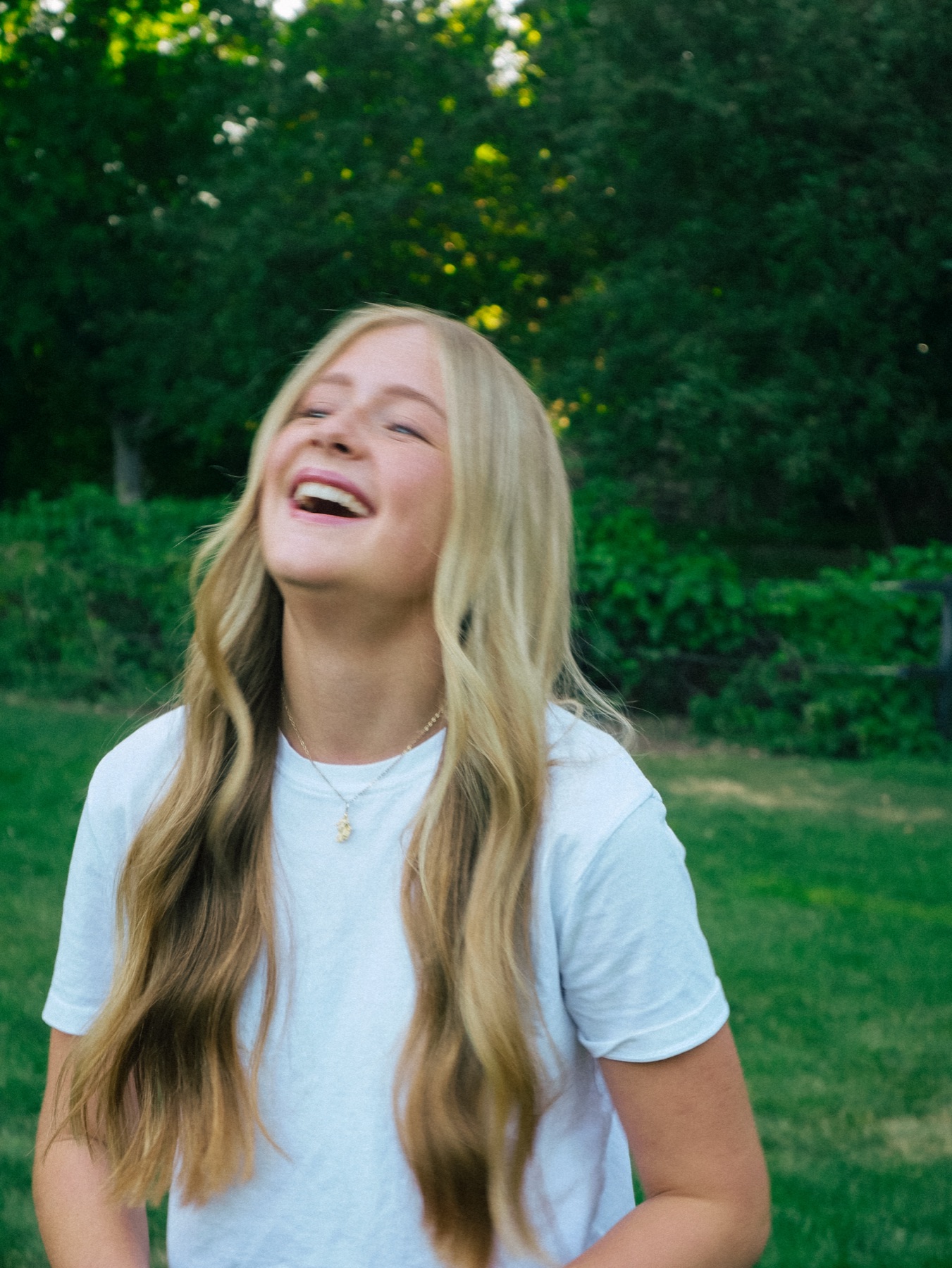 Senior portrait session laughing outdoors