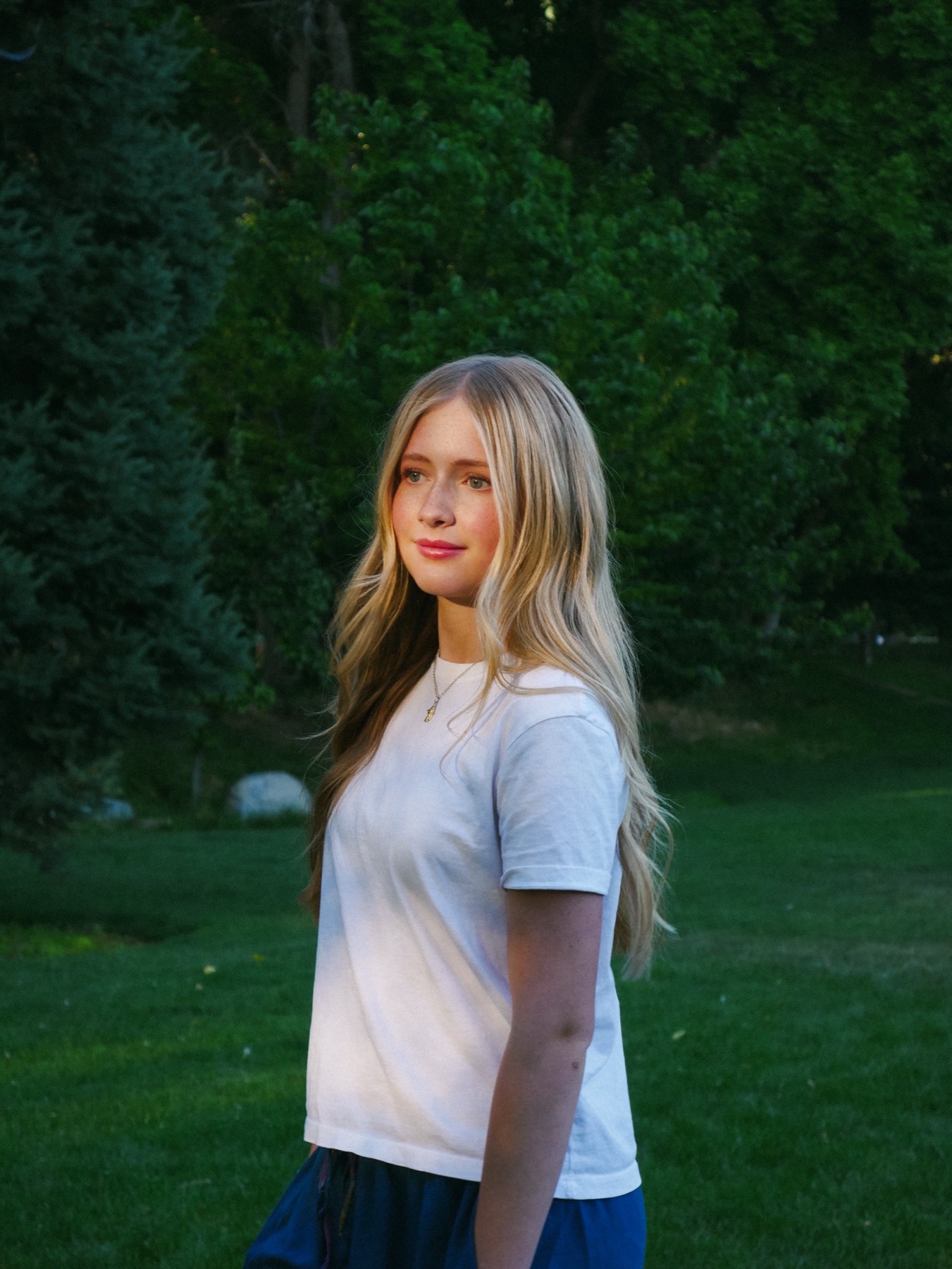 Senior portrait in a green field